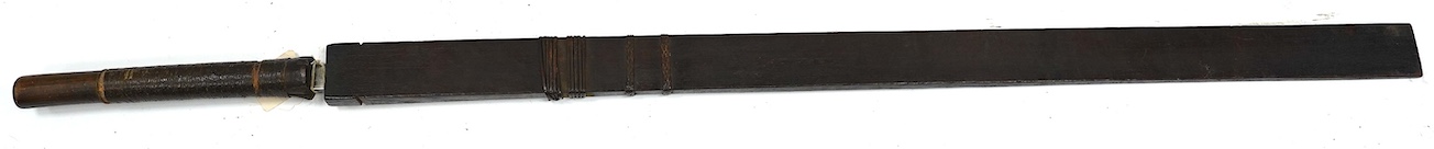 A 19th century Naga sword Dao, rattan bound wooden hilt in its open fronted wooden scabbard, blade 77cm. Condition - fair, some wear overall